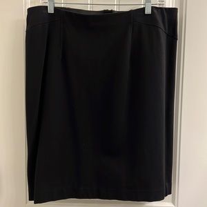 Ann Taylor Black Skirt in size 14 w/ elastic waist and zipper back.  Worn once.